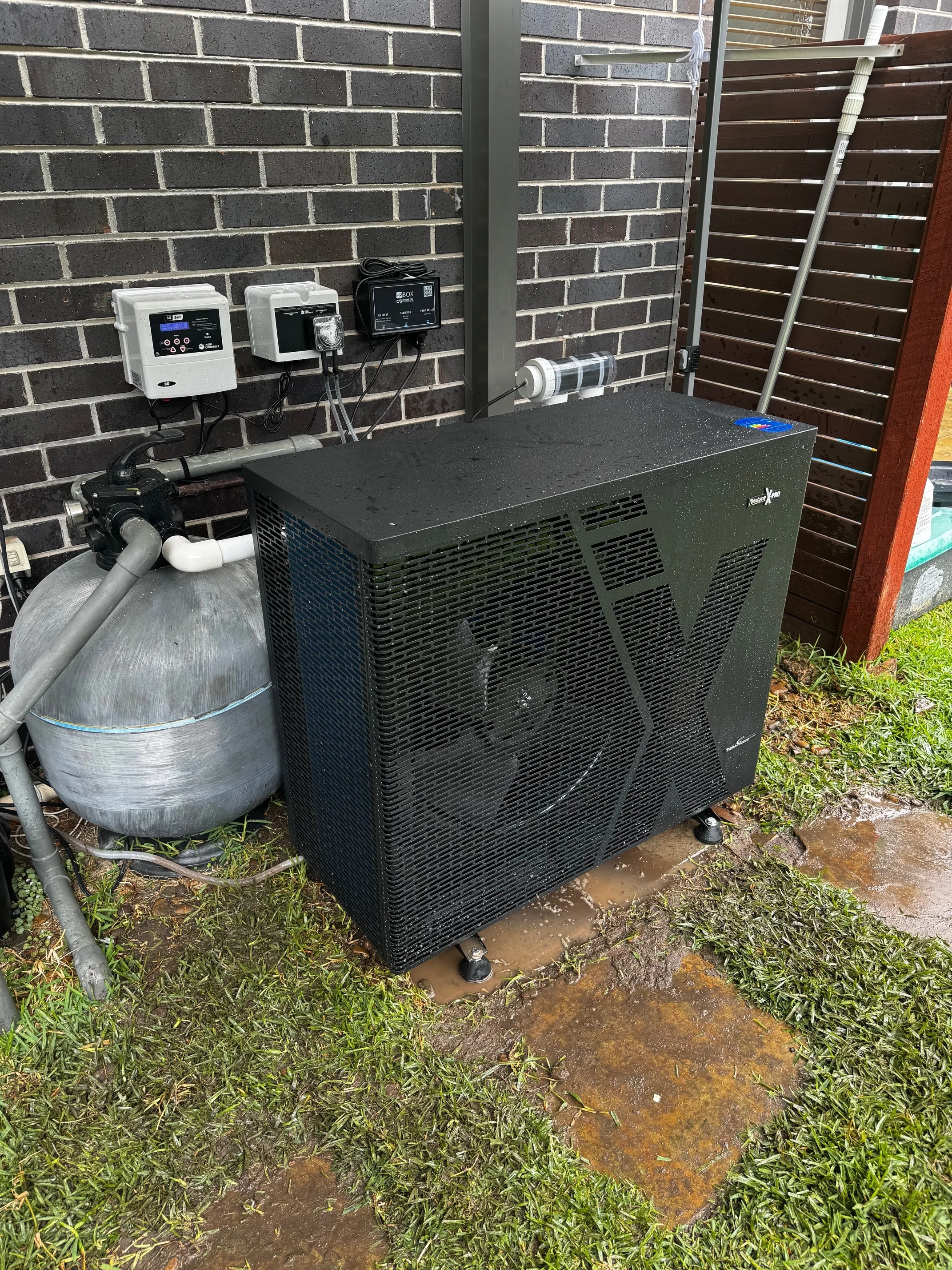 Pool heat pump installed beside a home