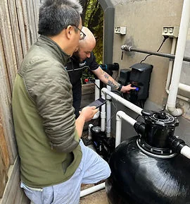 Palatial Pools technician working on pool equipment